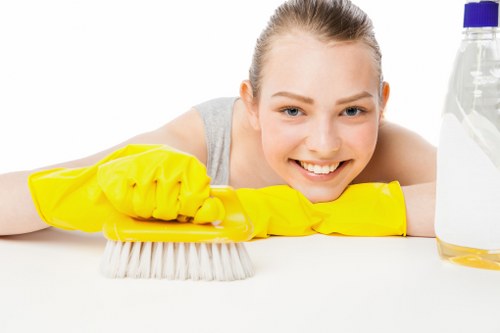 Local floor cleaning team working on a sealed hard floor surface