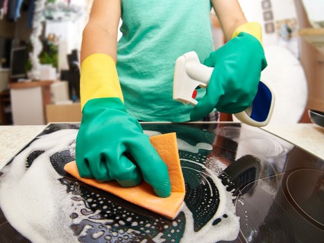 Deep cleaning kitchen and bathroom areas during a one-off clean in N2